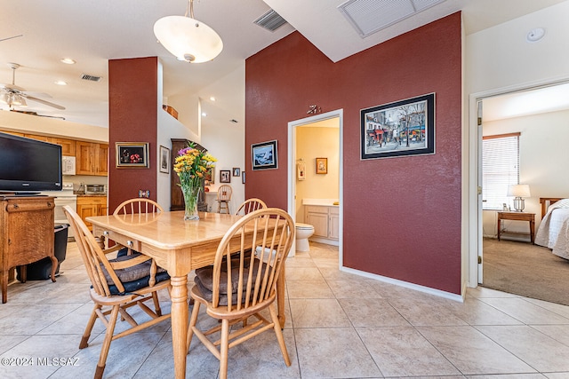 tiled dining area featuring ceiling fan