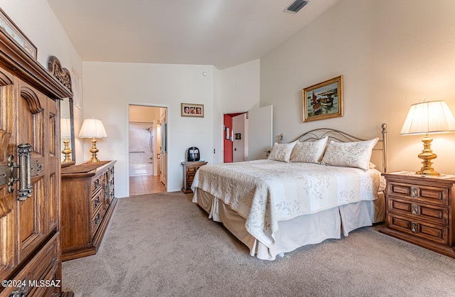 bedroom featuring light carpet