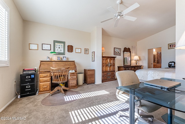 office area featuring light carpet, ceiling fan, and plenty of natural light