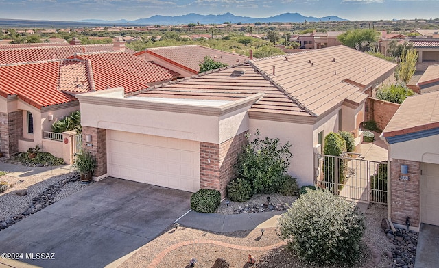 view of front of house featuring a garage and a mountain view