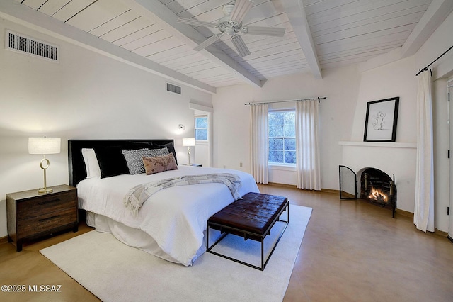 bedroom featuring beamed ceiling, ceiling fan, and wooden ceiling