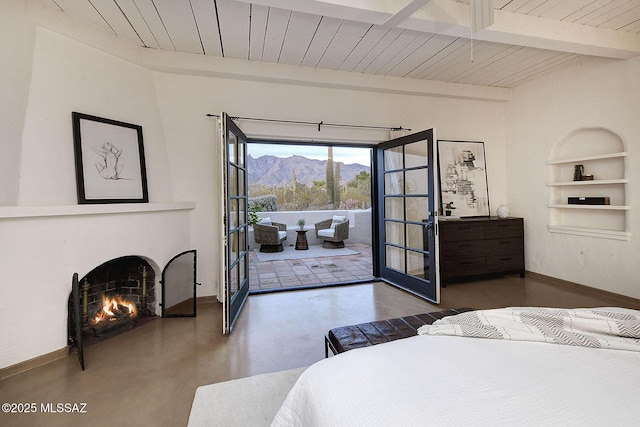 bedroom featuring access to exterior, french doors, wooden ceiling, beamed ceiling, and a mountain view