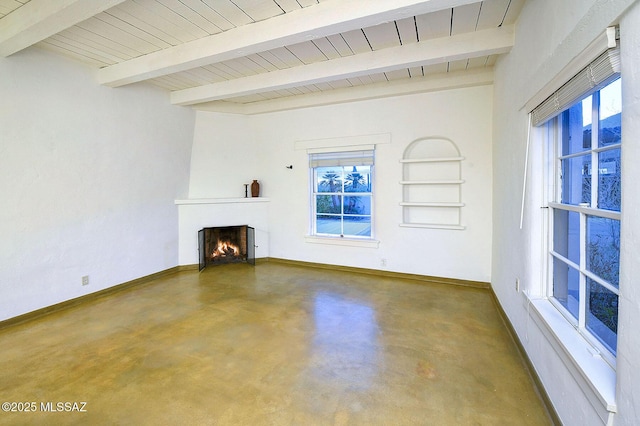 unfurnished living room with beam ceiling, wooden ceiling, a large fireplace, and concrete flooring