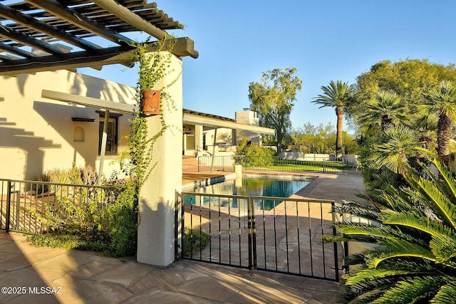 view of pool featuring a patio area and a pergola