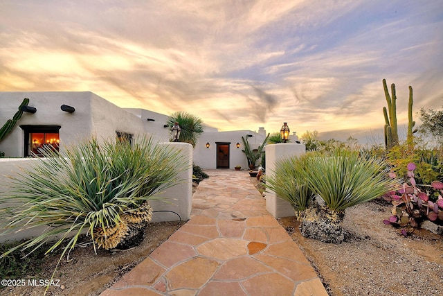 view of patio terrace at dusk