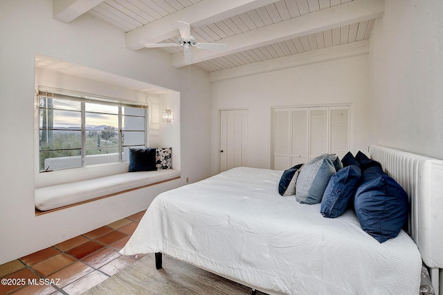 tiled bedroom featuring beamed ceiling, radiator heating unit, ceiling fan, and wooden ceiling