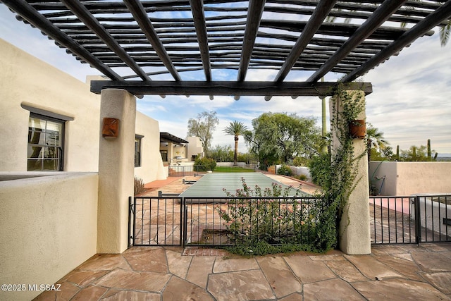 view of patio with a pergola and a swimming pool