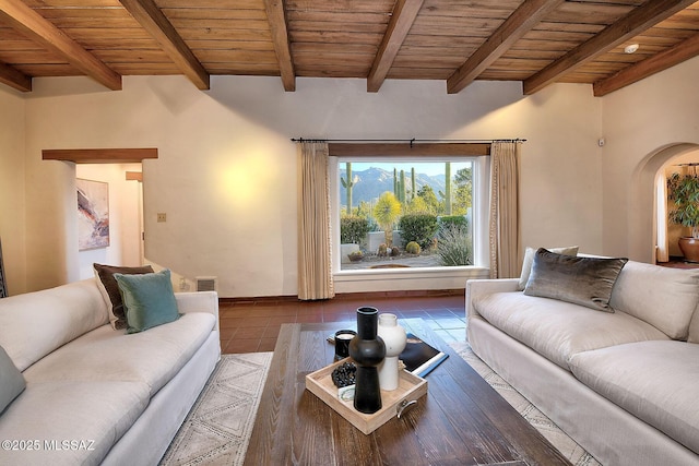 living room with beamed ceiling, tile patterned flooring, and wooden ceiling