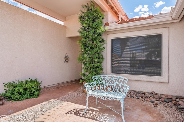 doorway to property featuring a patio