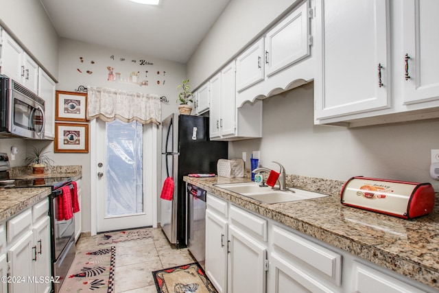 kitchen featuring stainless steel appliances, sink, and white cabinetry