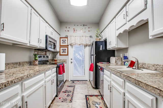 kitchen featuring white cabinets, stainless steel appliances, and sink