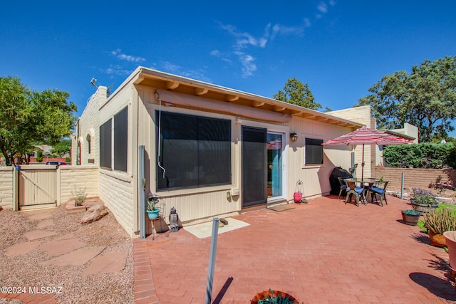 rear view of house with a patio