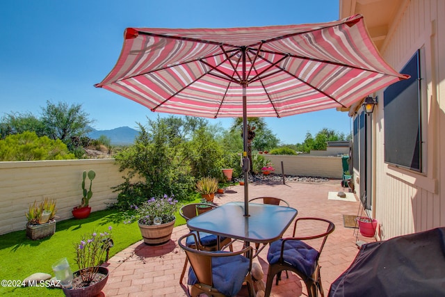 view of patio / terrace featuring a mountain view