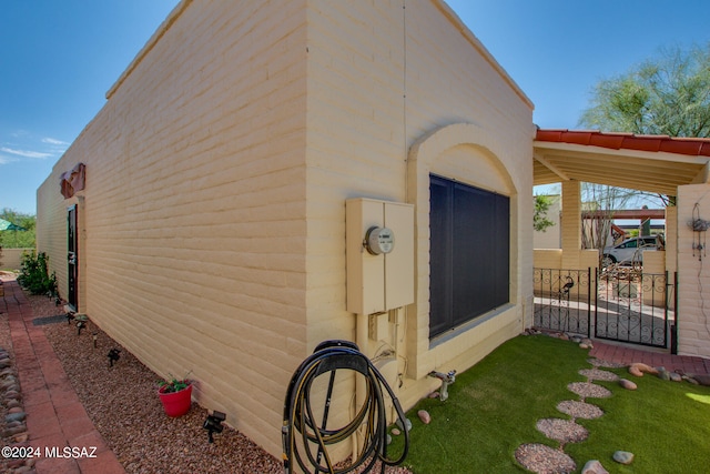 view of side of property with a yard