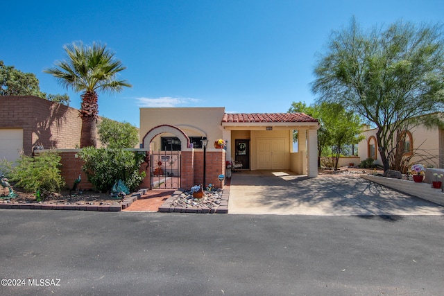 mediterranean / spanish-style home with a carport