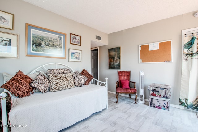 bedroom featuring a textured ceiling