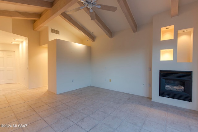 unfurnished living room featuring beam ceiling, high vaulted ceiling, light tile patterned floors, and ceiling fan