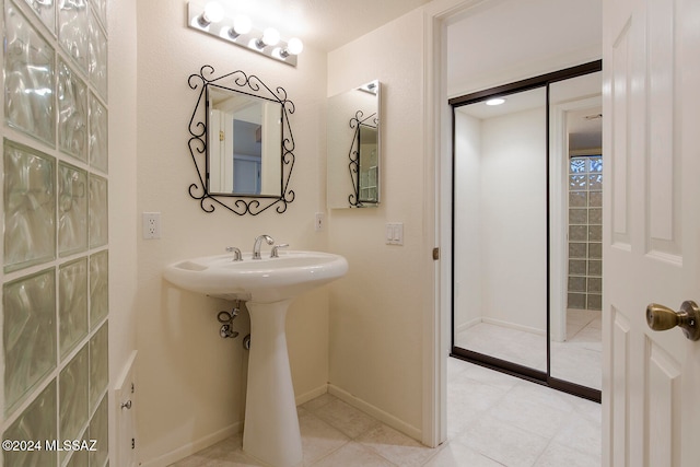 bathroom with tile patterned floors