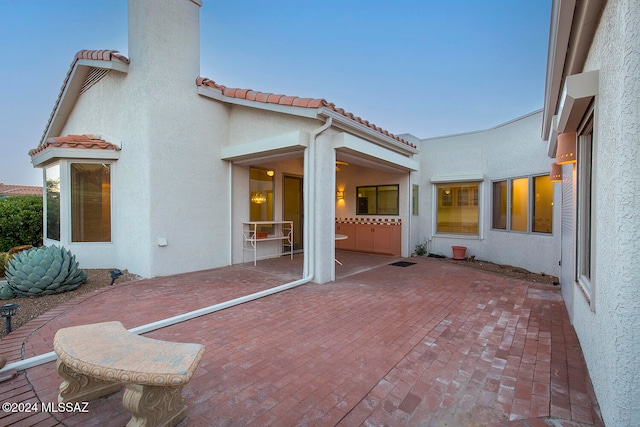 rear view of house with a patio