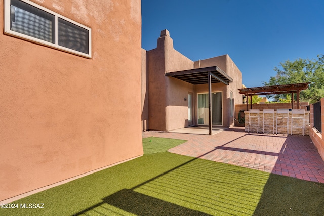 exterior space with a patio and a yard