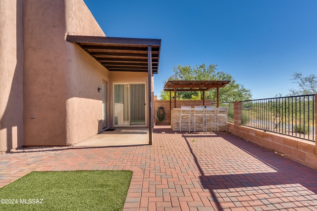 view of patio featuring a pergola