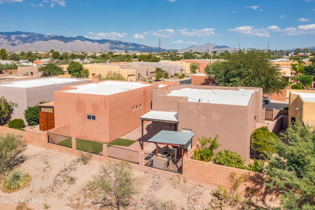 birds eye view of property featuring a mountain view