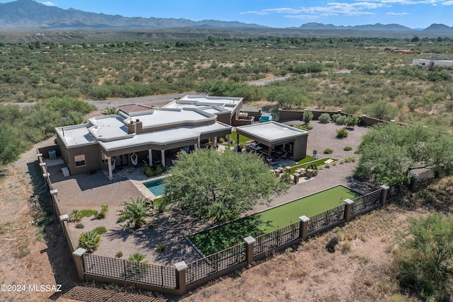 birds eye view of property with a mountain view