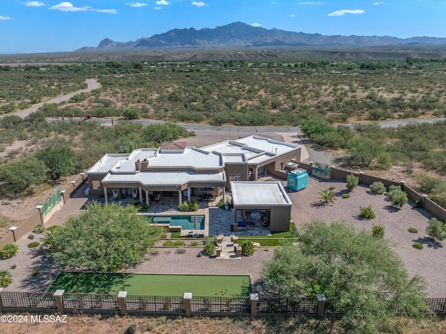 birds eye view of property featuring a mountain view