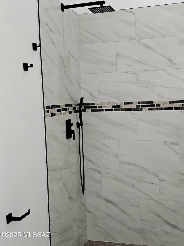 full bathroom with tiled shower