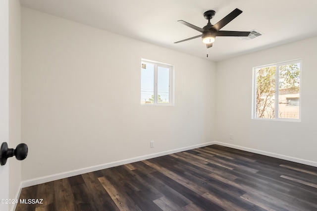 empty room featuring ceiling fan and dark hardwood / wood-style flooring