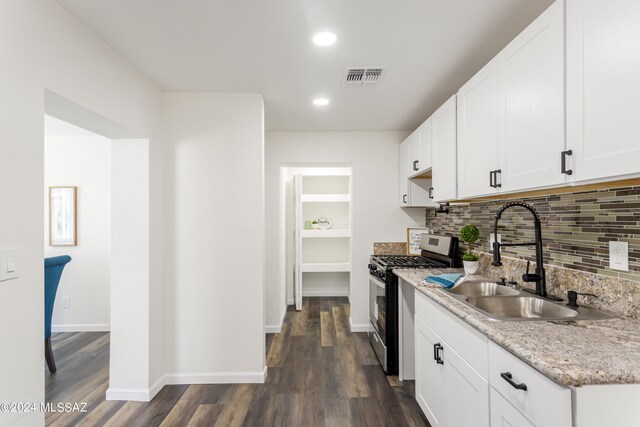 kitchen featuring white cabinets, stainless steel range with gas cooktop, and sink