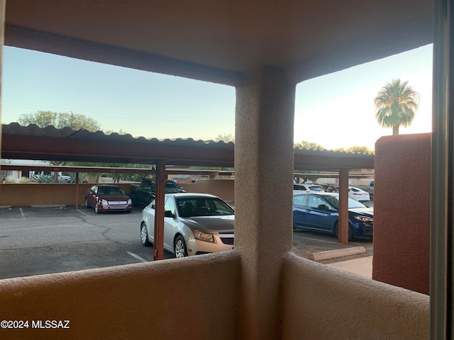 view of vehicle parking featuring a carport