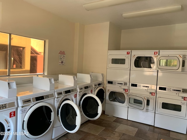 clothes washing area featuring stacked washer and dryer and washer and dryer