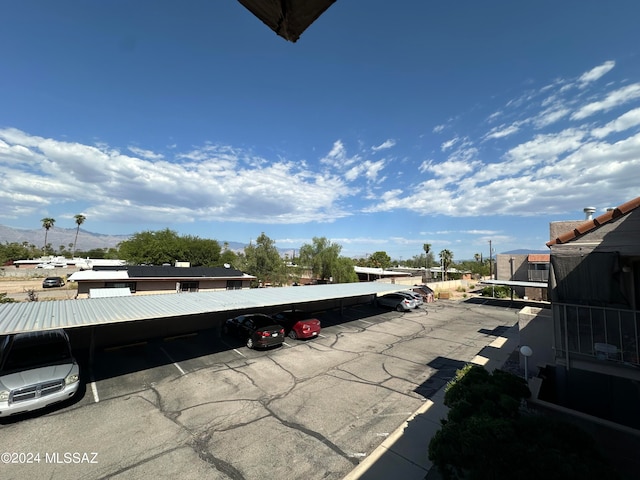 view of vehicle parking with a carport