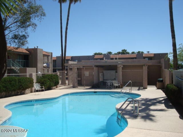 view of pool featuring a patio