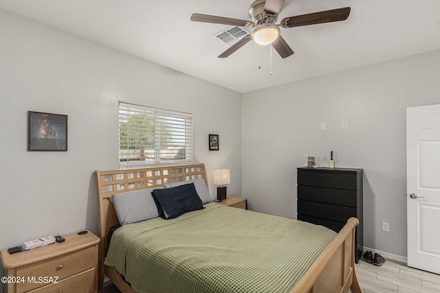 bedroom featuring ceiling fan and light hardwood / wood-style floors