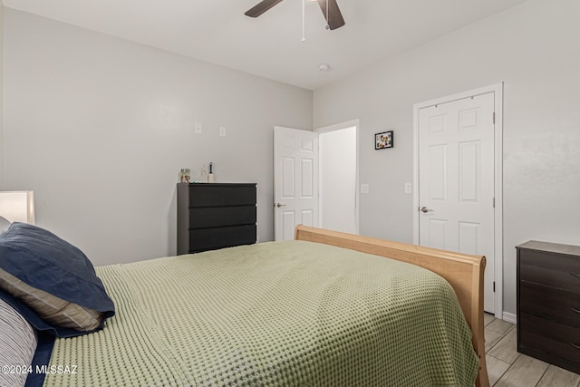 bedroom featuring light hardwood / wood-style floors and ceiling fan