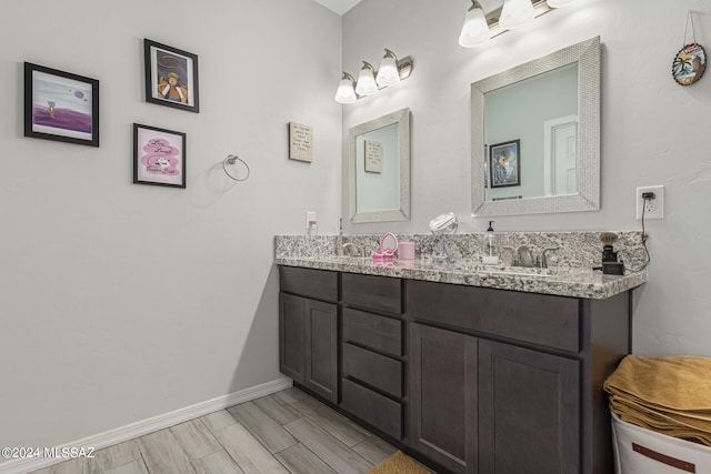 bathroom featuring vanity and hardwood / wood-style flooring