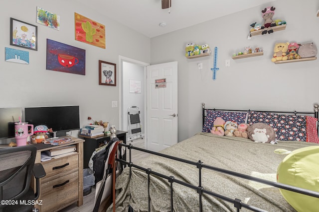 bedroom with wood-type flooring and ceiling fan