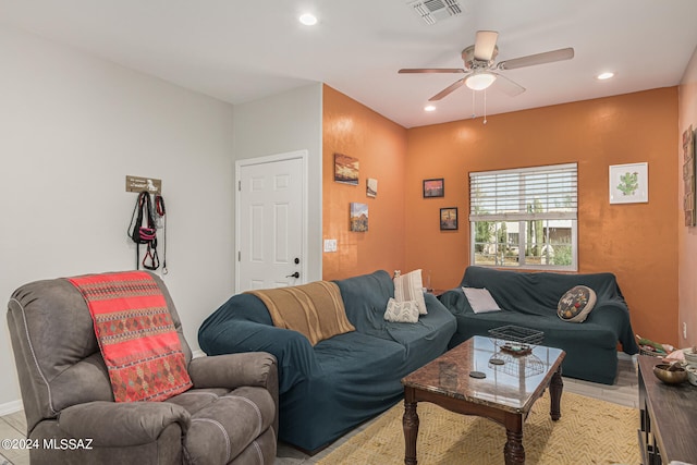 living room featuring ceiling fan and light wood-type flooring