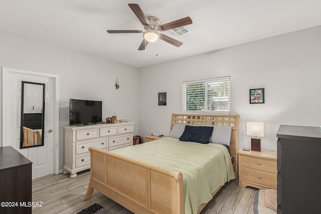 bedroom featuring light wood-type flooring and ceiling fan