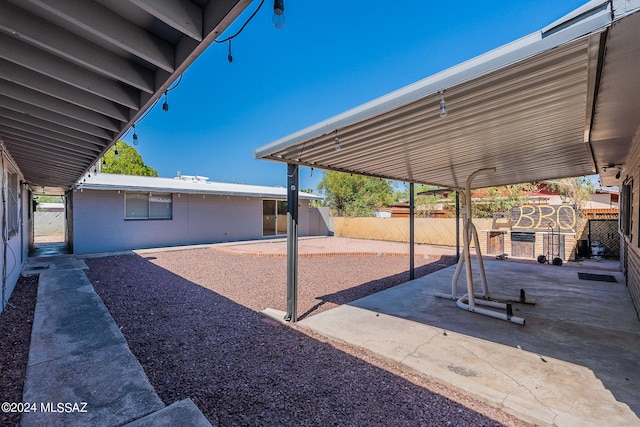 view of patio with a storage unit