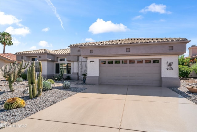 mediterranean / spanish house with a garage