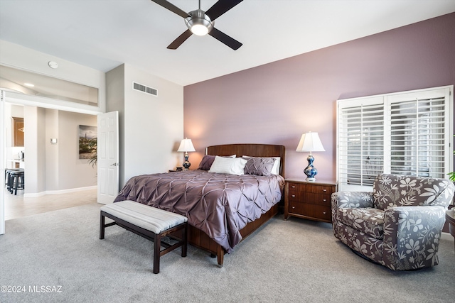 bedroom featuring ceiling fan and light colored carpet