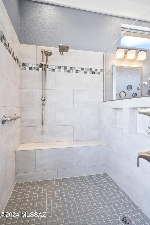 bathroom featuring a tile shower