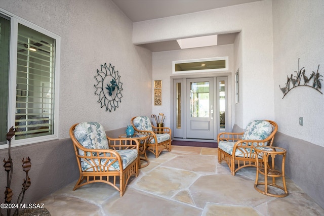 doorway to property with a patio