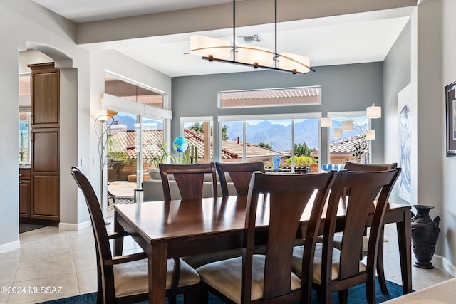 tiled dining area featuring a mountain view