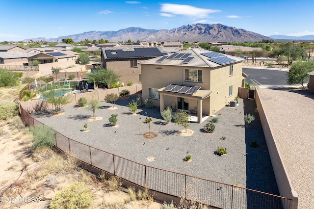 birds eye view of property with a mountain view