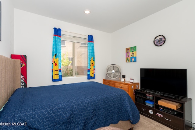 bedroom featuring light carpet