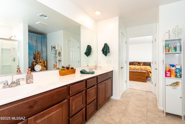 bathroom featuring tile patterned floors and vanity